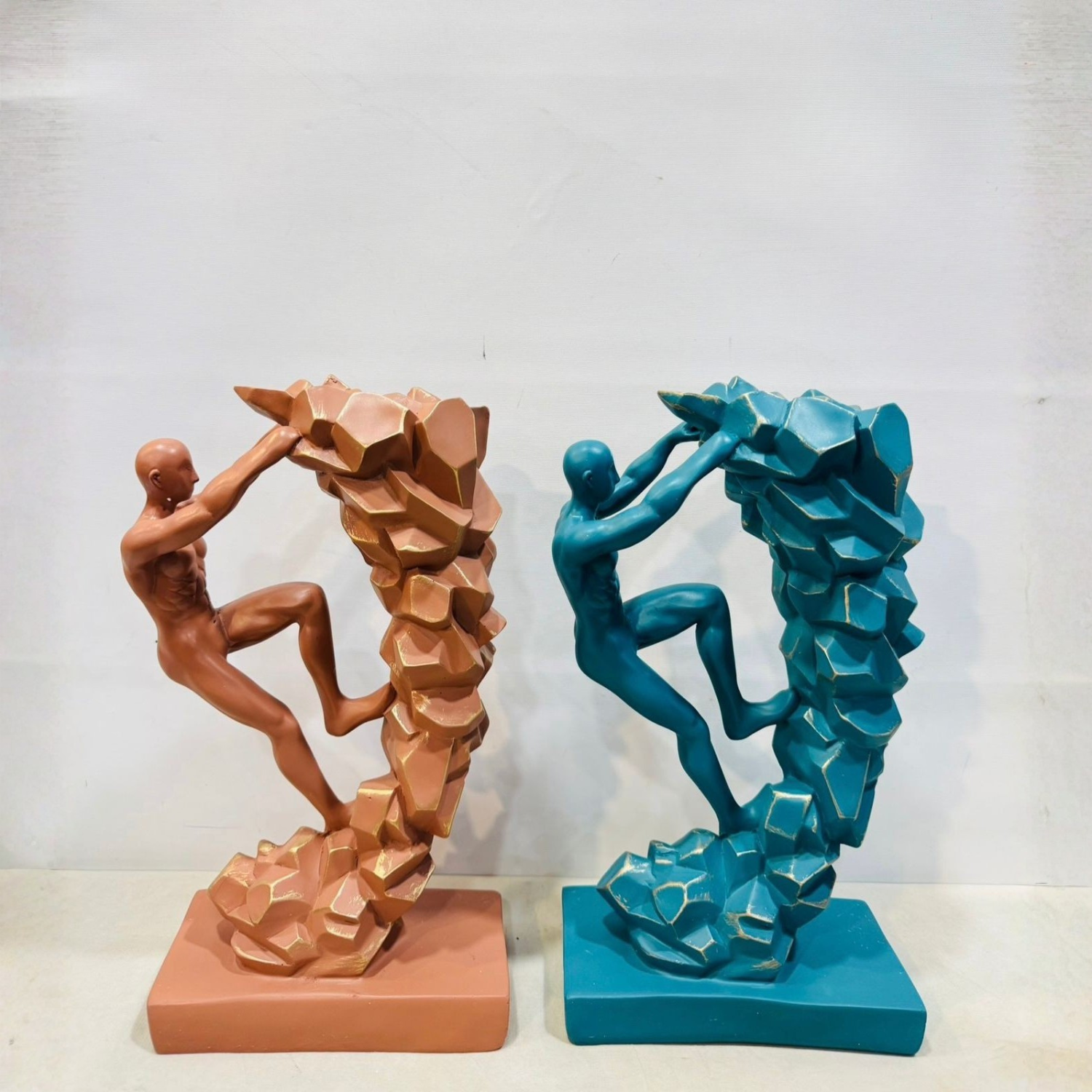 Modern Abstract Climbing Man Sculpture – Symbol of Strength & Success