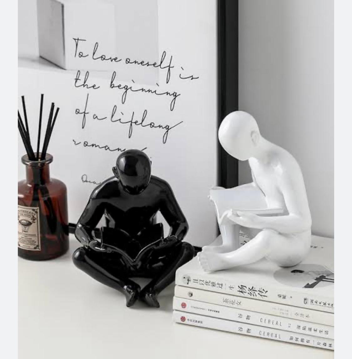 Man Reading a book sculpture