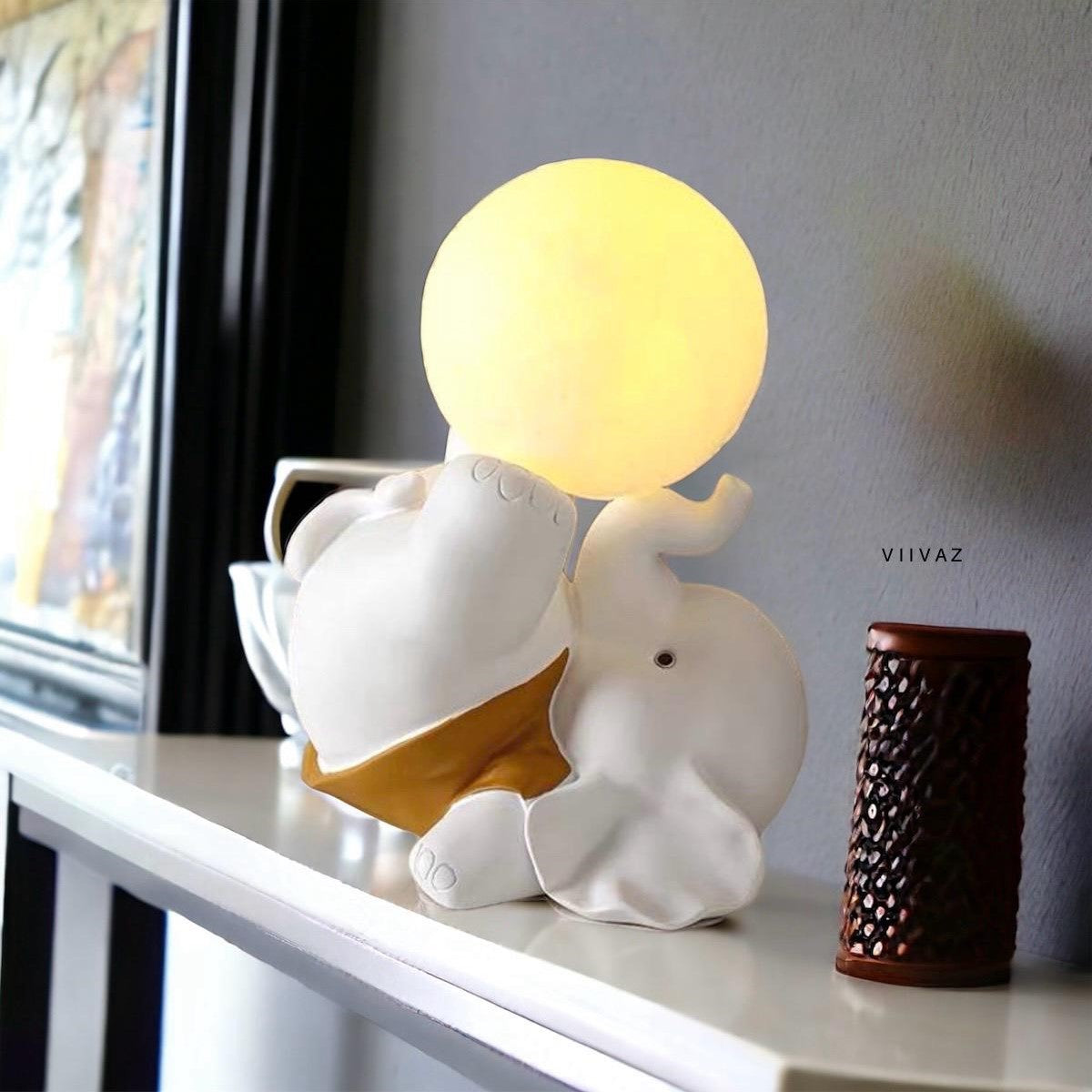 Joyful Baby Elephant with lamp