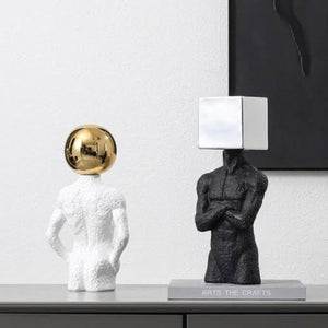 ELECTROPLATED SPHERE HEAD MAN SCULPTURE