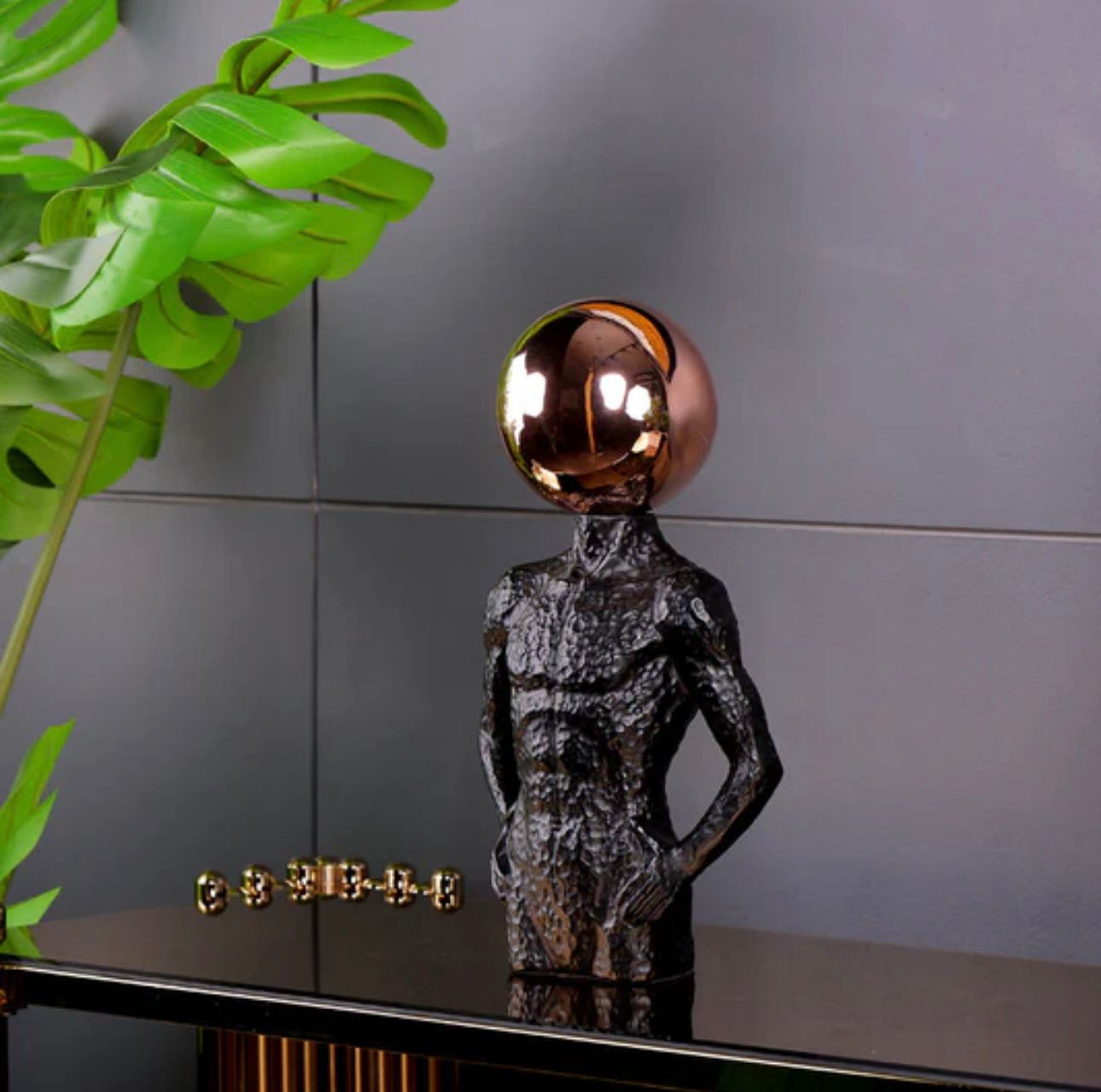 ELECTROPLATED SPHERE HEAD MAN SCULPTURE