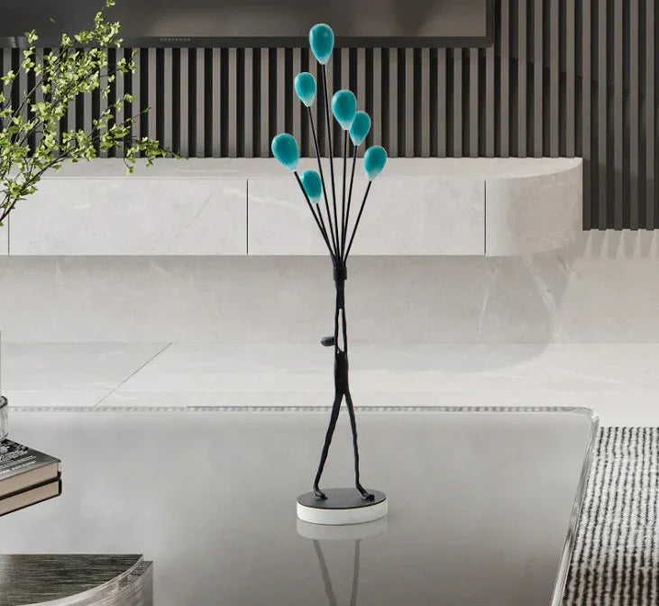 MAN HOLDING BALLOONS IN JOY