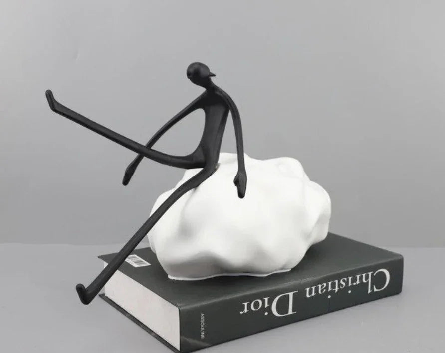 MAN SITTING ON A STONE