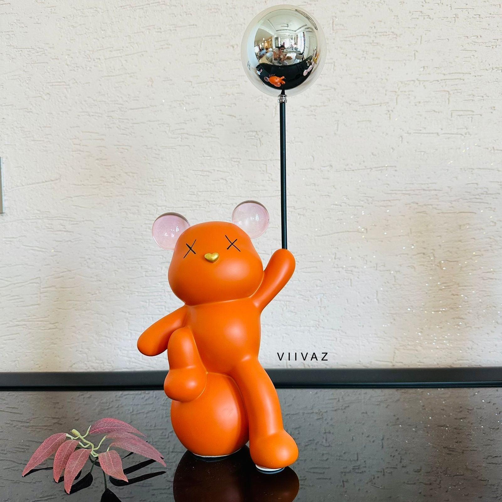 Celebrating Teddy Bear Holding a balloon