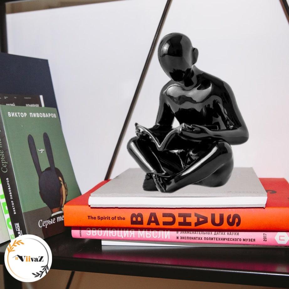 Man Reading a book sculpture