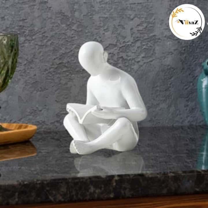 Man Reading a book sculpture